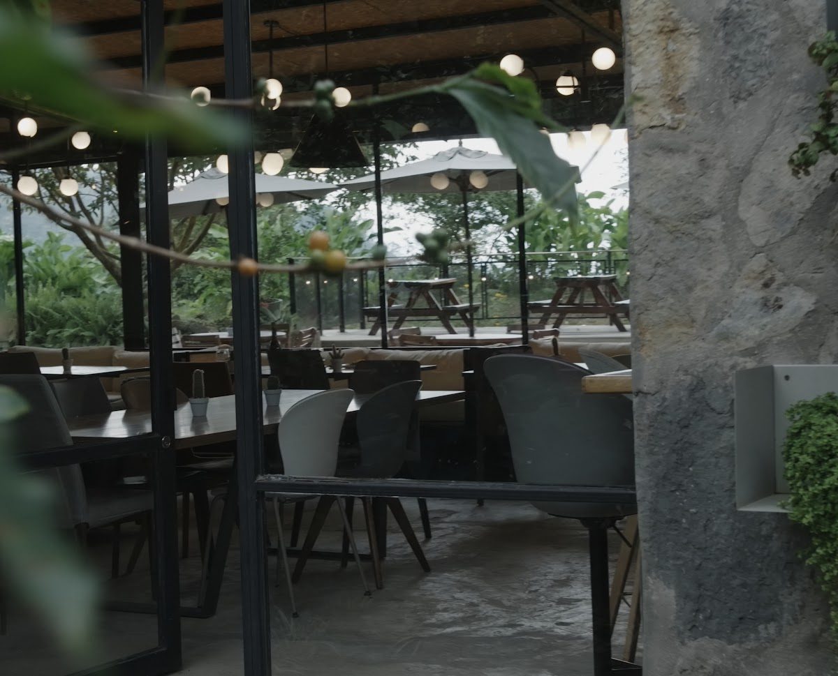 The glass-walled event space among the trees