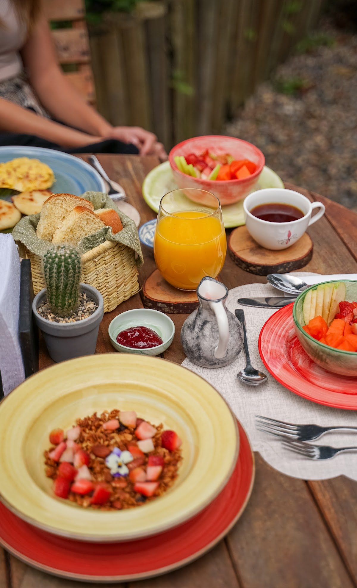 A breakfast spread of fresh Colombian fruit and juices