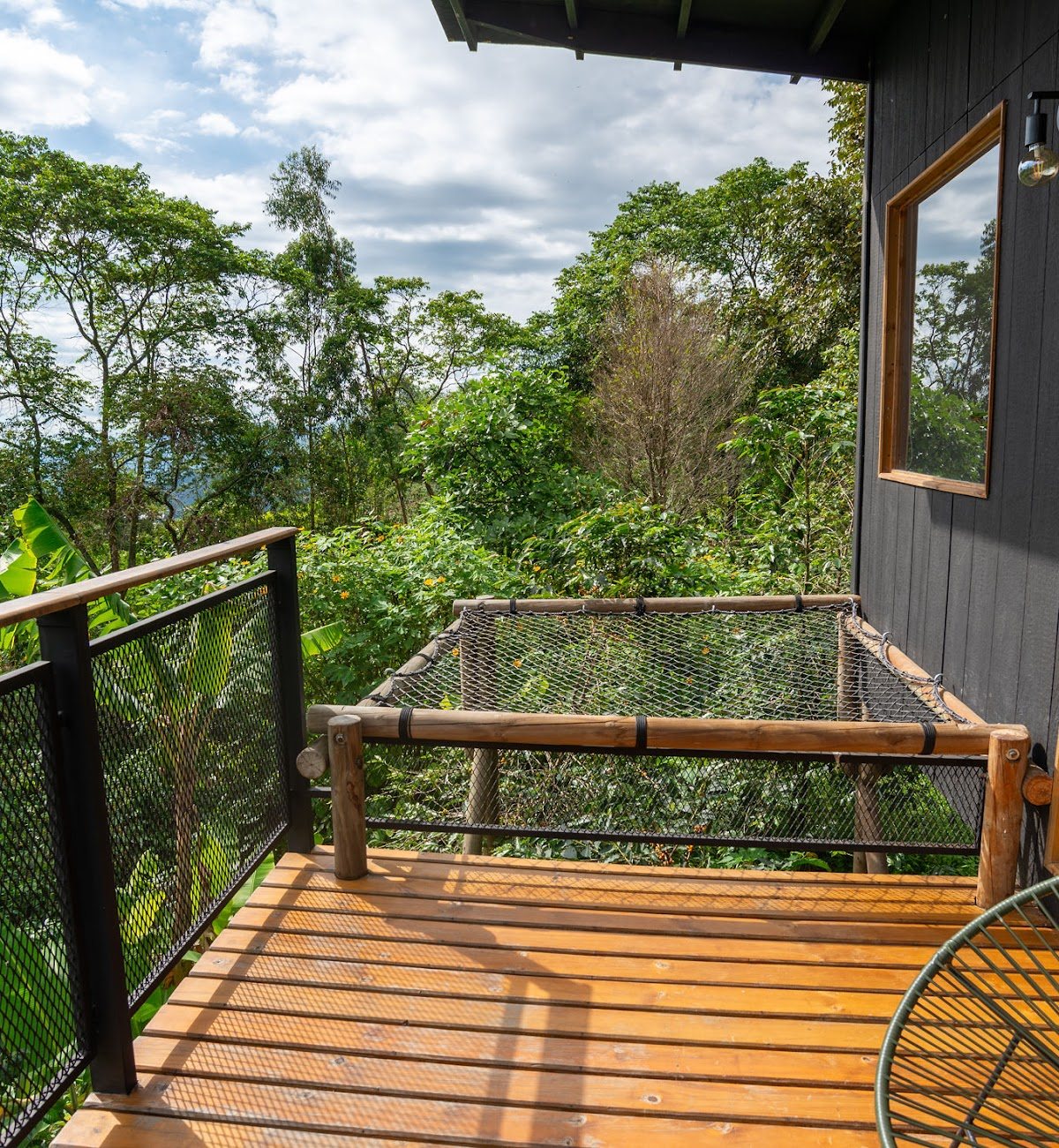 The room's private lounging net over the coffee trees