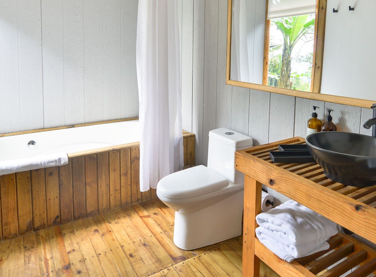 The room bathroom, bathtub and fixtures
